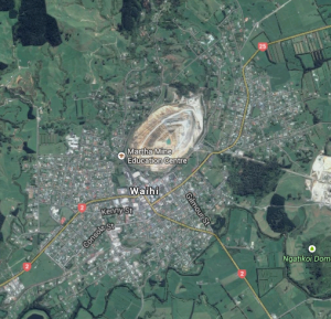 Waihi in Google Earth, showing the gaping maw of the Martha pit. SH2, the main thoroughfare, is marked.