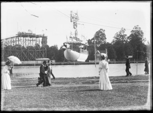 One of the gondolas of the aerial tramway whirrs by, the water chute is visible on the other side of Victoria Lake.