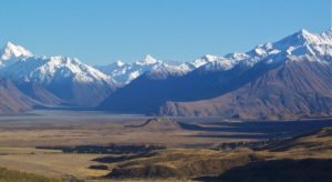 Rangitata Valley, with the rocky outcrop of Mt Sunday dwarfed by the Southern Alps.