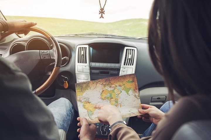 Couple With Map In Car